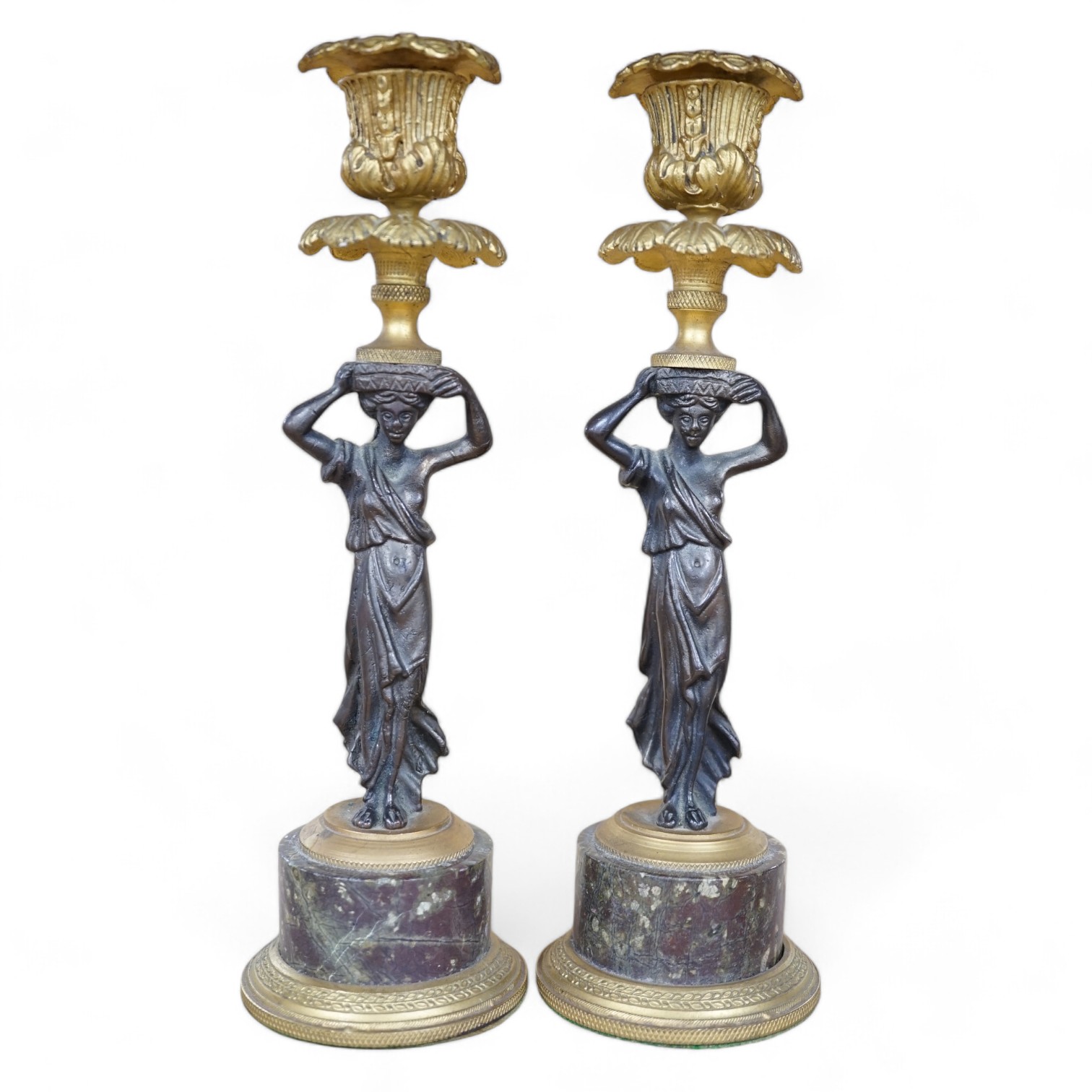 A pair of Regency style bronze and ormolu figural candlesticks on serpentine plinths, 22.5cm. Condition - fair to good